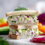 Delicious creamy tuna salad sandwich with avocado, ready in 15 minutes, perfect for quick lunches or holiday meals.